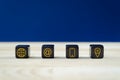 Wide view of customer service image with four black dices with gold contact information and location icons on them Royalty Free Stock Photo