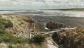 Wide view of the dark tannin water at the arthur river mouth in tasmania