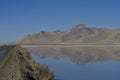 A wide view of f the country road along the salt ponds Royalty Free Stock Photo