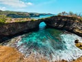 Wide view of the famous Broken bridge of Bali from the cliff. Famous tourist destination in Nusa Penida island in Bali. Beautiful
