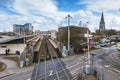 Wide view of Feltham railway station and the tower of the now-demolished St Catherine`s Church.