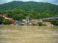 Wide view of Ganga river in Rishikesh India. Cable rope bridge over the Ganga river Royalty Free Stock Photo