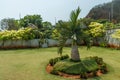 Wide view of green garden from viewpoint with a tiny palm tree in the foreground , Kailashgiri, Visakhapatnam, March 05 2017