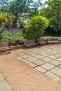 Wide view of group of unoccupied wooden seats or chairs arranged in a garden or park, Chennai, India, April 1st 2017