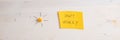 Wide view image of a yellow paper with Dont worry sign on it placed on wooden background Royalty Free Stock Photo