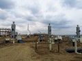 Wide view of an industrial construction site with process towers, pipelines, and heavy equipment Royalty Free Stock Photo