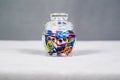 Wide view of a jar of multi colored can pull tabs Royalty Free Stock Photo
