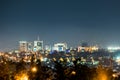 A wide view of Kigali city skyline lit up at night, under a deep Royalty Free Stock Photo