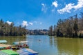 Wide view of lake with boats, beautiful tress in the background, Ooty, India, 19 Aug 2016