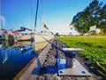 Wide view on metal bollard or hook on a quay where moored sailboats