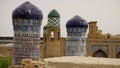 Old tiled towers with blue domes in Xiva