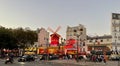 Wide view of the Moulin Rouge night club across the Boulevard de Clichy, Paris, France