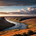 Wide view over a flat valley in the highlands of Iceland, a river winds with many river branches through the