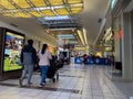 Lynnwood, WA USA - circa January 2023: Wide view of people shopping inside the Alderwood Mall