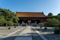 Wide view of the stone path flanked by potted trees leading to a Ming Dynasty imperial gate Royalty Free Stock Photo