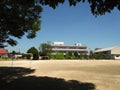 Saitama / Japan - 08/12/20: An empty schoolyard with playground equipment and buildings on a sunny day. Royalty Free Stock Photo