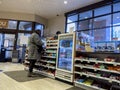 Lynnwood, WA USA - circa November 2022: Wide view of a woman checking out at the counter of a Rite Aid Pharmacy