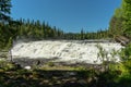 Wide waterfall in bright summer sunshine