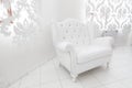 Wide white armchair