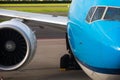 A close-up photograph of a commercial wide-body jetliner