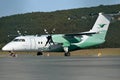 Wideroe passenger airplane on terminal