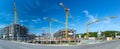 Widescreen panorama shot of large construction site with cranes and foundations Royalty Free Stock Photo