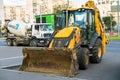 Widespread model of universal backhoe loader of JCB Company Great Britain of recognizable yellow colour. Royalty Free Stock Photo