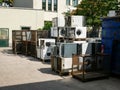 Wien/Austria - june 4 2019: discarded washing machines piled outside of a recycling and recovery compound in vienna Royalty Free Stock Photo