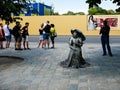 Wien/Austria - june 4 2019: an Street actress outside of Schonbrunn palace in vienna with a gray dress looking as an sculpture Royalty Free Stock Photo