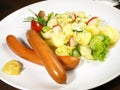 Fine smoked Sausages with Potato Salad and Mustard Royalty Free Stock Photo