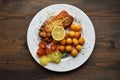 Wiener schnitzel with potato croquettes and lemon freshened