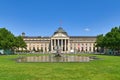 Wiesbaden, Germany - Convention center called `Kurhaus` with park and fountain on sunny day Royalty Free Stock Photo