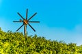 Wiew at wind mill on vineyard of south styrian wine route in Austria in sunset. Glanz an der Weinstrasse.