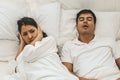 Wife can`t sleep Because the husband snores loudly on bedroom in morning. Royalty Free Stock Photo