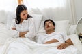 Wife can`t sleep Because the husband snores loudly on bedroom in morning. Royalty Free Stock Photo