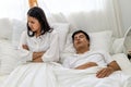 Wife can`t sleep Because the husband snores loudly on bedroom in morning. Royalty Free Stock Photo