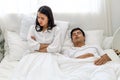 Wife can`t sleep Because the husband snores loudly on bedroom in morning. Royalty Free Stock Photo