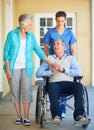 Wife, caregiver or old man talking in wheelchair in hospital clinic helping an elderly patient for support. Disabled Royalty Free Stock Photo