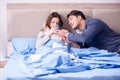 The wife caring for sick husband at home in bed Royalty Free Stock Photo