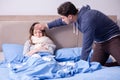 The wife caring for sick husband at home in bed Royalty Free Stock Photo