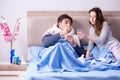 The wife caring for sick husband at home in bed Royalty Free Stock Photo