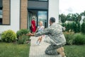 Wife and daughter meeting their American hero at home