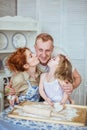 Wife and a little daughter kiss her father Royalty Free Stock Photo