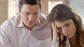 Wife mad at husband looking down, family quarreling, crisis in relationships