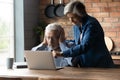 Wife provide simple guidance to puzzled old husband use laptop