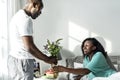 Wife receives flowers bouquet from her husband