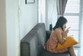 Wife reconcile talking mobilephone to her husband at the living room,Negative attitude emotions