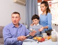 Wife and son asking husband for more money Royalty Free Stock Photo