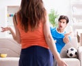 Wife unhappy that husband is watching football