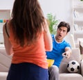 Wife unhappy that husband is watching football